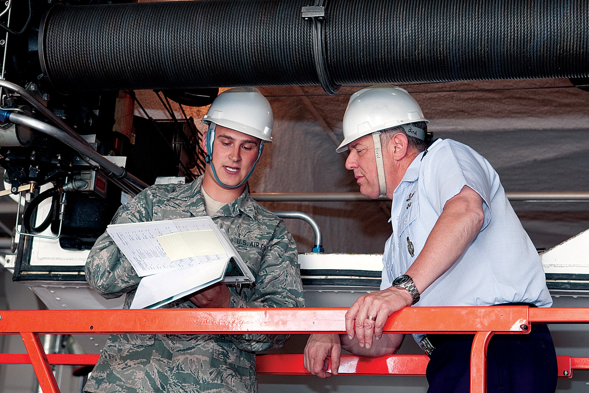 Staff Sgt. Chris Bird, 90th Maintenance Operations Squadron, briefs Maj. Gen. C. Donald Alston, 20th Air Force commander, on transporter erectors in the maintenance bay during his base familiarization tour Monday. General Alston spoke with many Airman across the base about the importance of their contribution to the Air Force’s top priority. (U.S. Air Force photo by Jeff Allred)