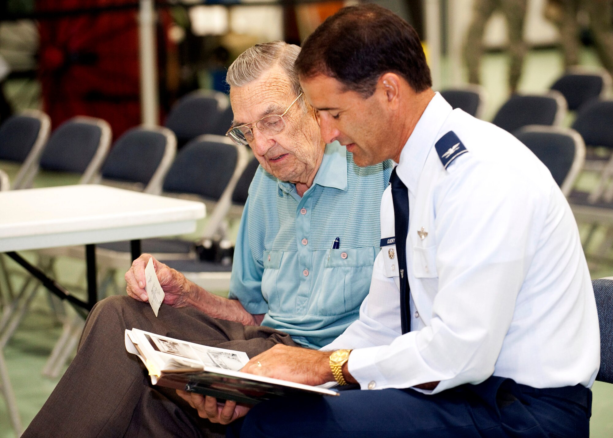 Col. Michael Guidry, Air Armament Center chief of safety, talks with Lt. Col.(Ret) Allan D. Howser during a memorial ceremony at the Air Armament Museum July 12.  Colonel Howser was a witness and survivor of the explosive mishap in 1943 that killed 17 people.  The memorial was one of the Explosives Safety Day events.  Courtesy photo.
