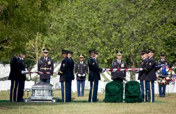 Soldiers from The Old Guard prepare to fold two American flags that were draped over two caskets containing the remains of seven Airmen who died in Burma in 1944 July 15, 2010 at Arlington National Cemetery, Va. (DOD photo/Michael Tolzmann)