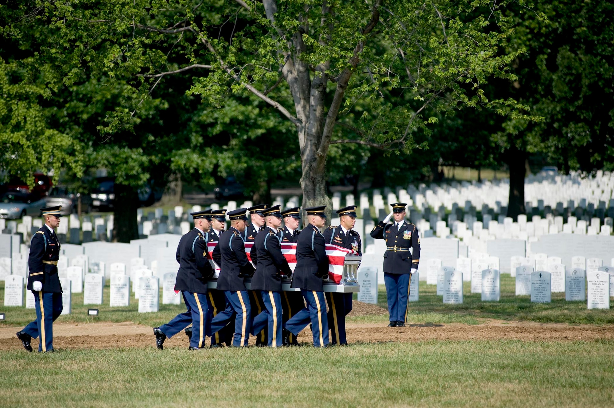 Soldiers from the 3rd U.S. Infantry Regiment, The Old Guard, carry a casket containing the remains of six Airmen, who died during World War II in Burma July 15, 2010 at Arlington National Cemetery, Va. (DOD photo/Michael Tolzmann)