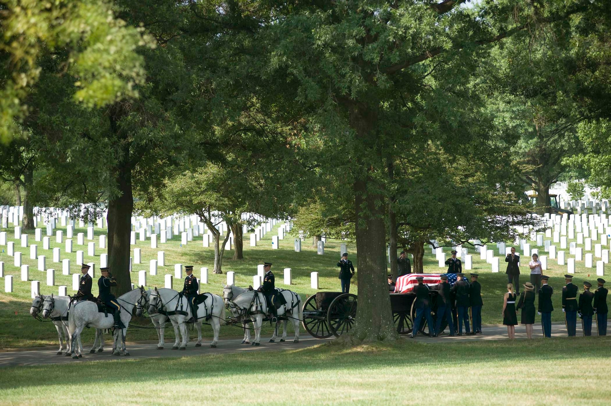 A casket containing the remains of six Airmen, who perished in 1944 in a C-47 aircraft crash in Burma, is removed from a horse-drawn caisson July 15, 2010 at Arlington National Cemetery, Va. The downed aircraft had a crew of seven - all of whom where interned here in two caskets following repatriation. (DOD photo/Michael Tolzmann)