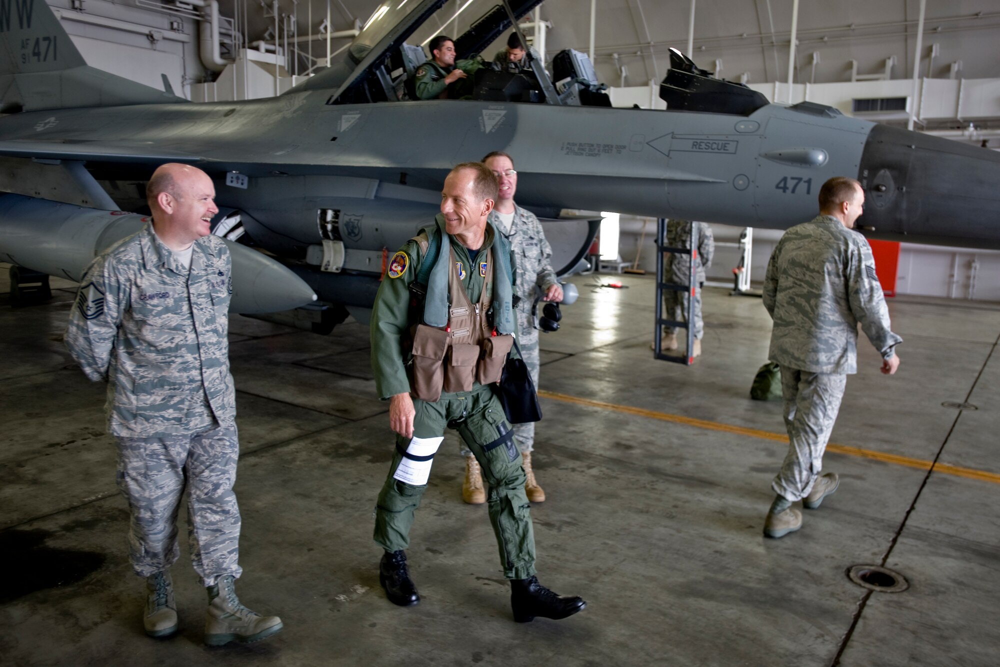 MISAWA AIR BASE, Japan -- Col. David Stilwell, 35th Fighter Wing commander, shares laughs with his launch crew in preparation for his final flight as wing commander July 14. Colleagues, friends and family of Colonel Stilwell came out to see him off and welcome him back from his last 35th FW flight. (U.S. Air Force photo/Senior Airman Jamal D. Sutter)