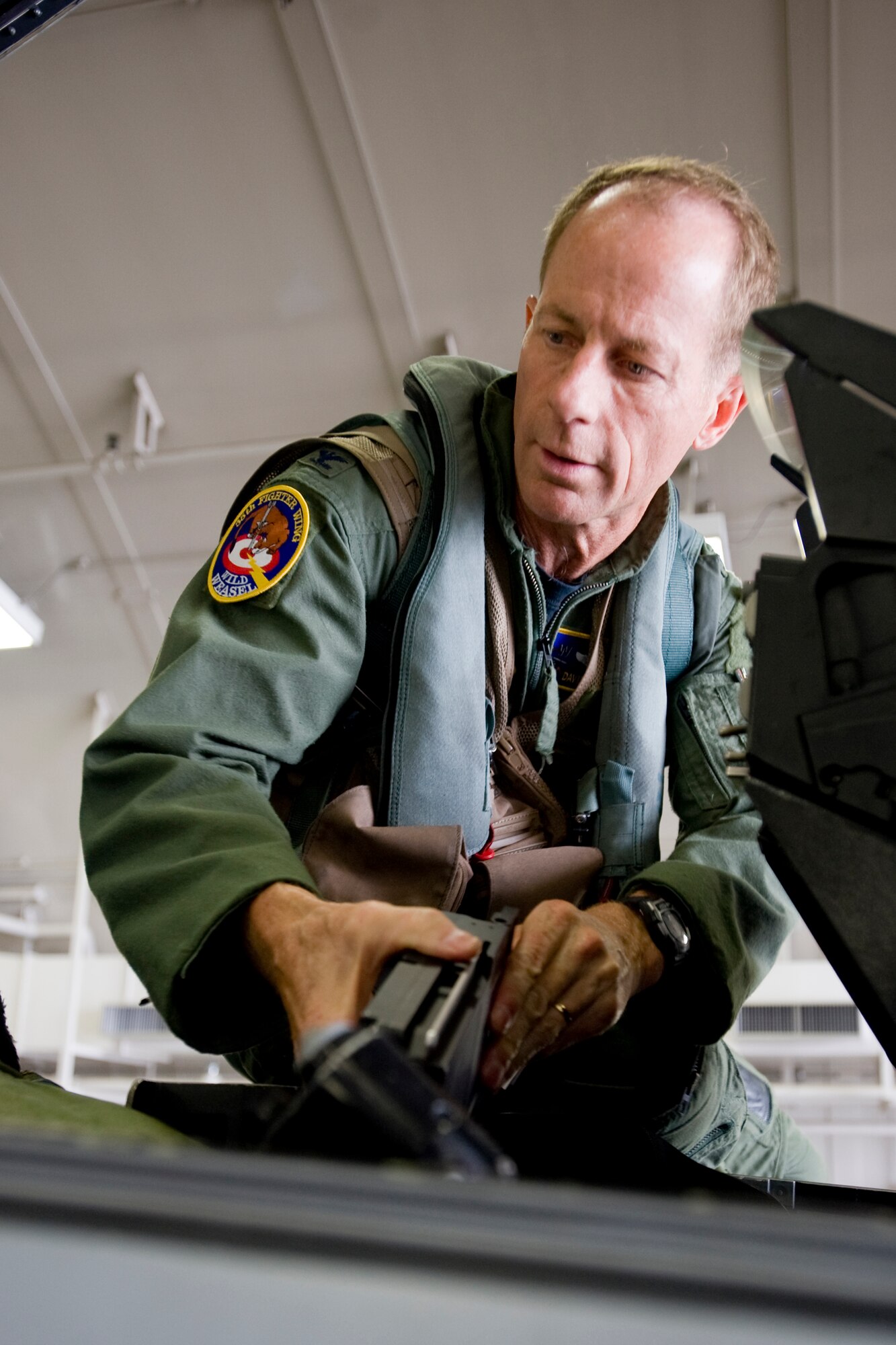 MISAWA AIR BASE, Japan -- Col. David Stilwell, 35th Fighter Wing commander, enters an F-16 Fighting Falcon cockpit July 14. The flight was Colonel Stilwell's final flight as commander and marked the end of a chapter in 35th FW history. (U.S. Air Force photo/Senior Airman Jamal D. Sutter)