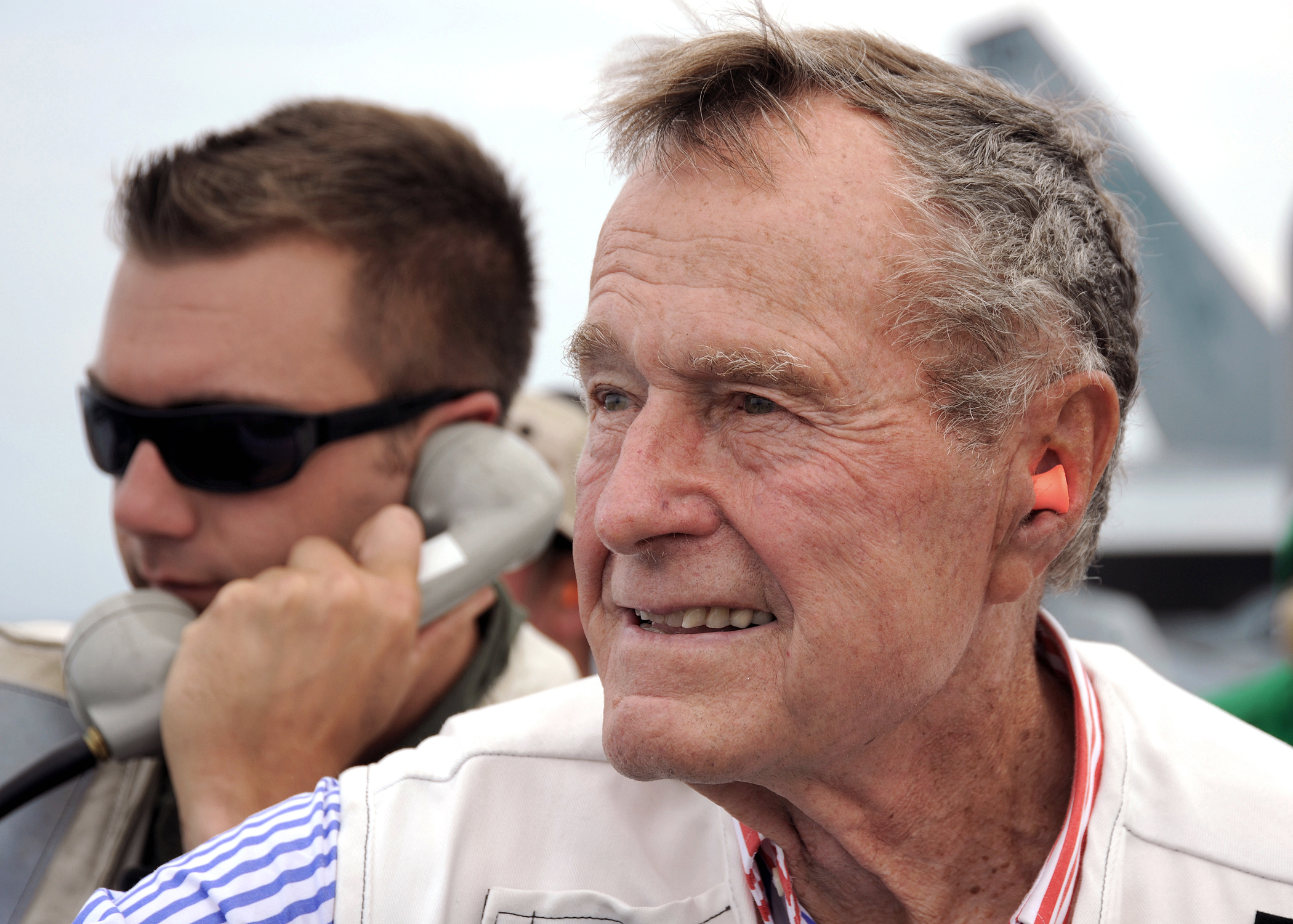 Former President H.W. Bush watches flight operations from the