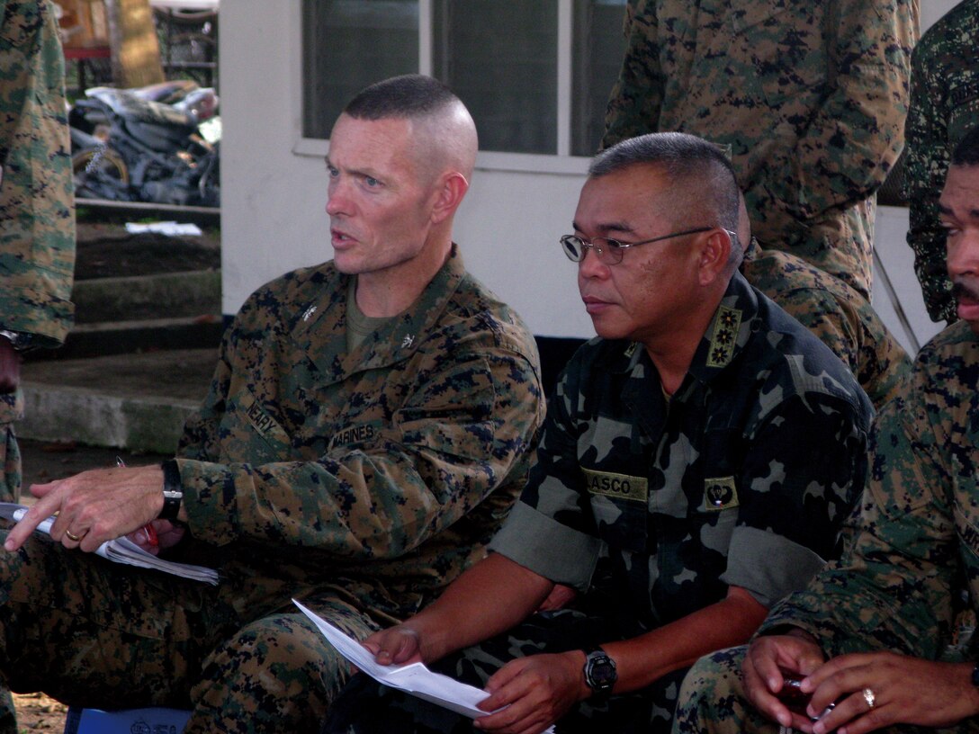 Colonel Stephen Neary, commanding officer of 4th Marine Regiment Headquarters, 3rd Marine Division, III Marine Expeditionary Force and Colonel Elvin Velasco, Philippine 1st Marine Brigade provide planning and execution guidance to the Combined Marine exercise training group.