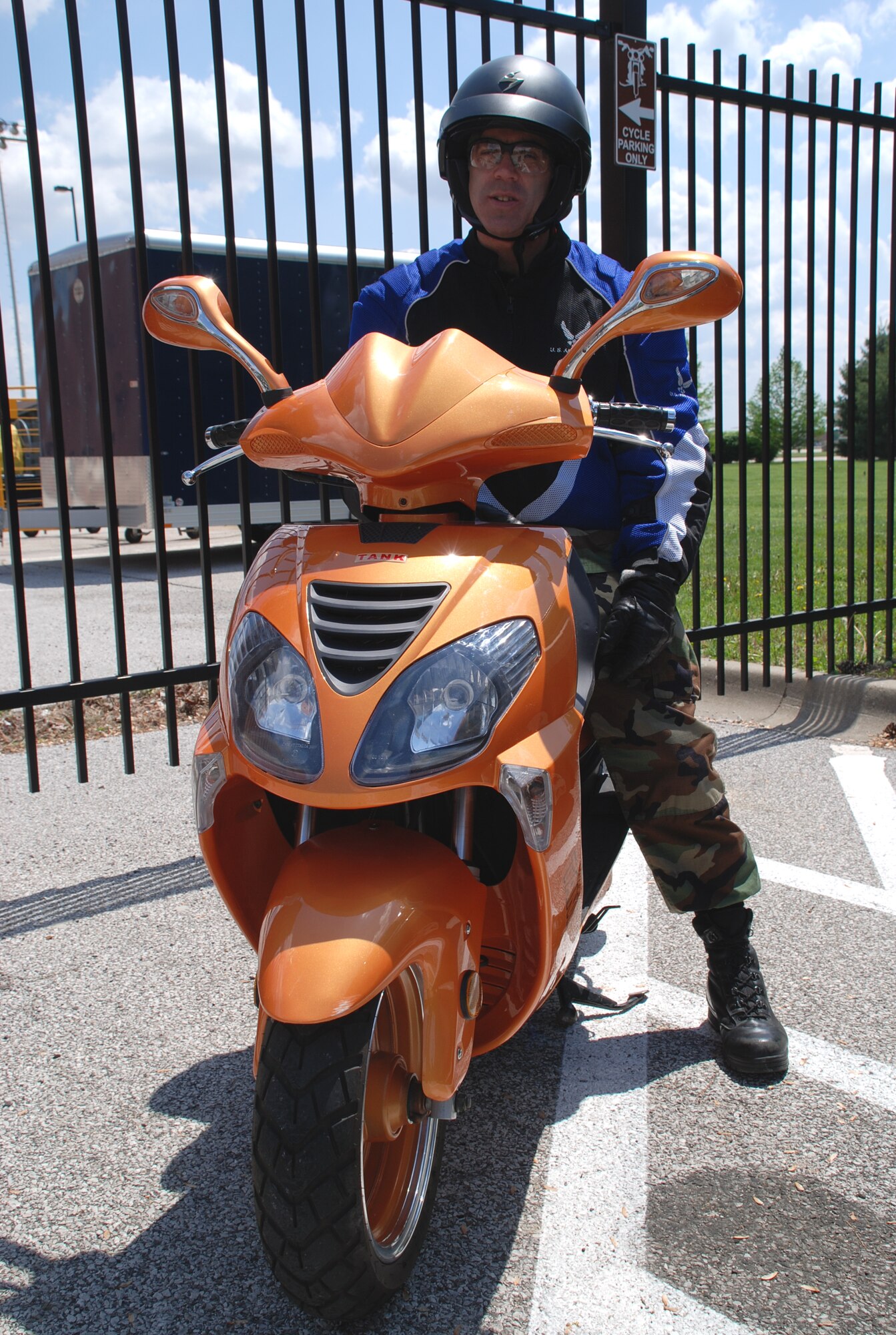 Tech. Sgt. Paul Carissimo has a motorcycling and scooter driving reminder for everyone:  Always wear gloves, boots, pants, and a helmet while riding any type of cycle.  Be safe, and have fun.  (U.S. Air Force photo/Maj. Stan Paregien)
