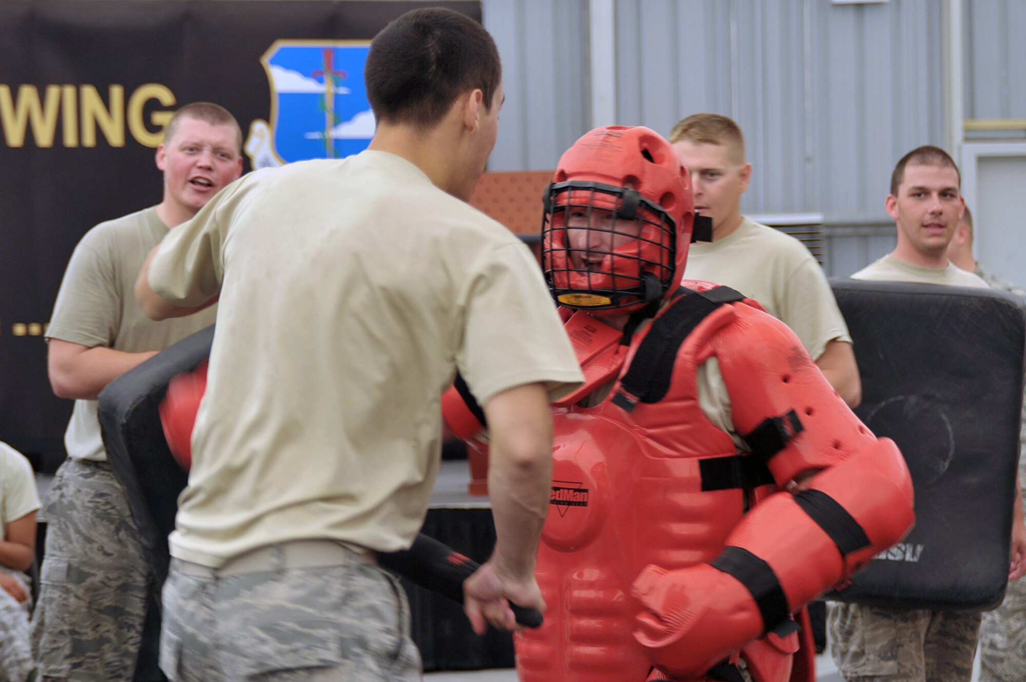 A 380th Expeditionary Security Forces Squadron Force Protection Airman trains with Tech Sgt. James Parkis, 380th Security Forces Squadron kennel master, July 16 at an undisclosed location in Southwest Asia.  Sergeant Parkis is one of several ESFS Airmen that helped train Force Protection Airmen on using an asp for protection. (U.S. Air Force photo/Tech. Sgt. April Wickes)