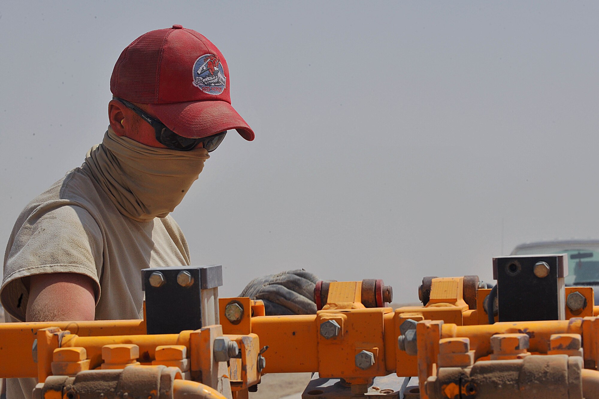 U.S. Air Force Staff Sgt. Derek Phelps drills dowel holes into an unfinished runway at Camp Dwyer, Afghanistan, June 25, 2010.  The runway will be used to accommodate heavier aircraft at Camp Dwyer.  Sergeant Phelps is a heavy equipment operator and deployed to the 809th Expeditionary Red Horse Squadron.  (U.S. Air Force photo/Staff Sgt. Quinton Russ/released)