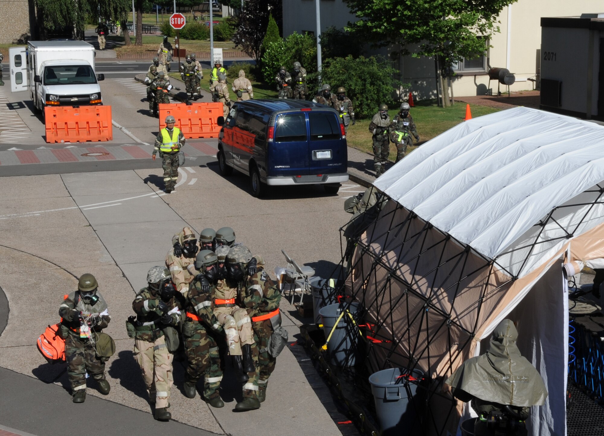 Members from the 86th Medical Group bring in 'wounded' victims for treatment during an operational readiness exercise (ORE), Ramstein Air Base, Germany, July 18, 2010. An ORE incorporates a series of scenarios to evaluate a base's ability to execute operational duties under simulated wartime conditions. (U.S. Air Force Photo by Senior Airman Caleb Pierce)