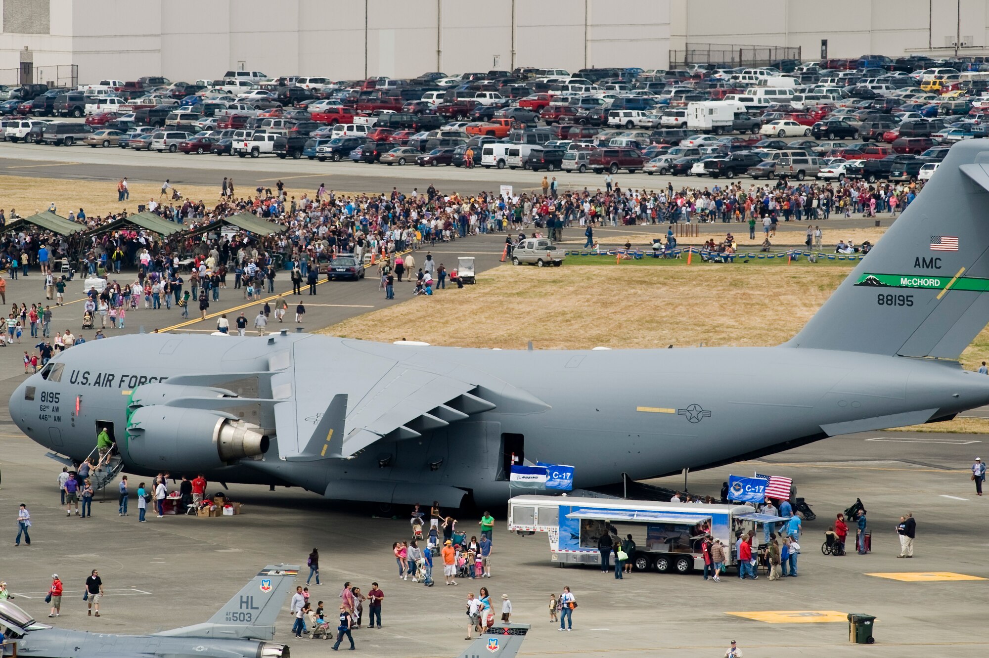 The Air Expo crowd pours in around a C-17 Globemaster III on static display July 17 at McChord Field. (U.S. Air Force Photo/Abner Guzman)