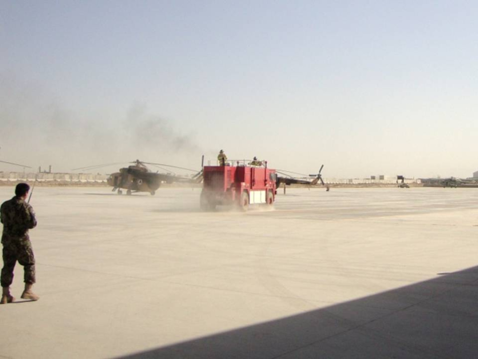KANDAHAR, Afghanistan - Firefighters from the Kandahar Air Wing respond to a simulating a helicopter crash on July 11th, 2010. (U.S. military photo/RELEASE).