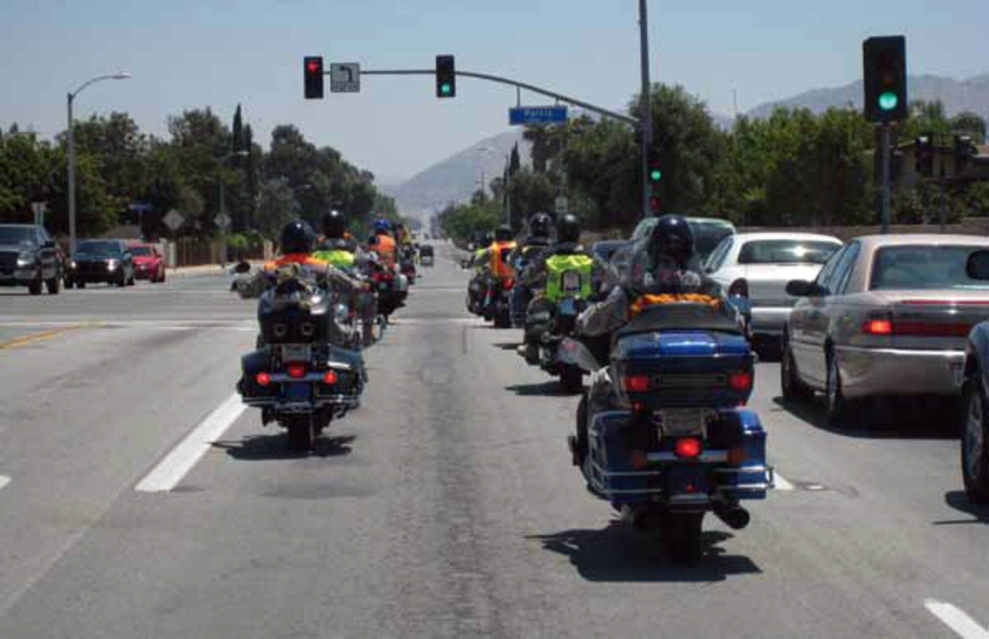 Fourth Air Force Airmen recently cruise down the streets of Moreno Valley as part of the Fourth Air Force motorcycle safety ride. Maj. Gen. Eric W. Crabtree, Fourth Air Force commander, led the ride to highlight the practical application of motorcycle safety skills such as defensive riding and riding through different types of terrain. (U.S. Air Force photo by 2nd Lt. Zach Anderson)
