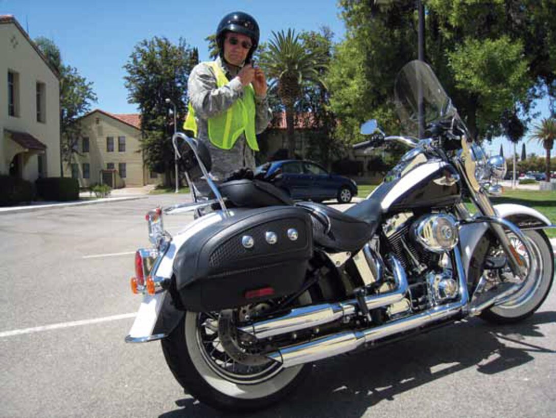 Maj. Gen. Eric W. Crabtree, 4th Air Force Commander, dons his helmet before leading a motorcycle safety ride from base. The ride highlighted the practical application of motorcycle safety skills.” (U.S. Air Force photo by 2nd Lt. Zach Anderson)
