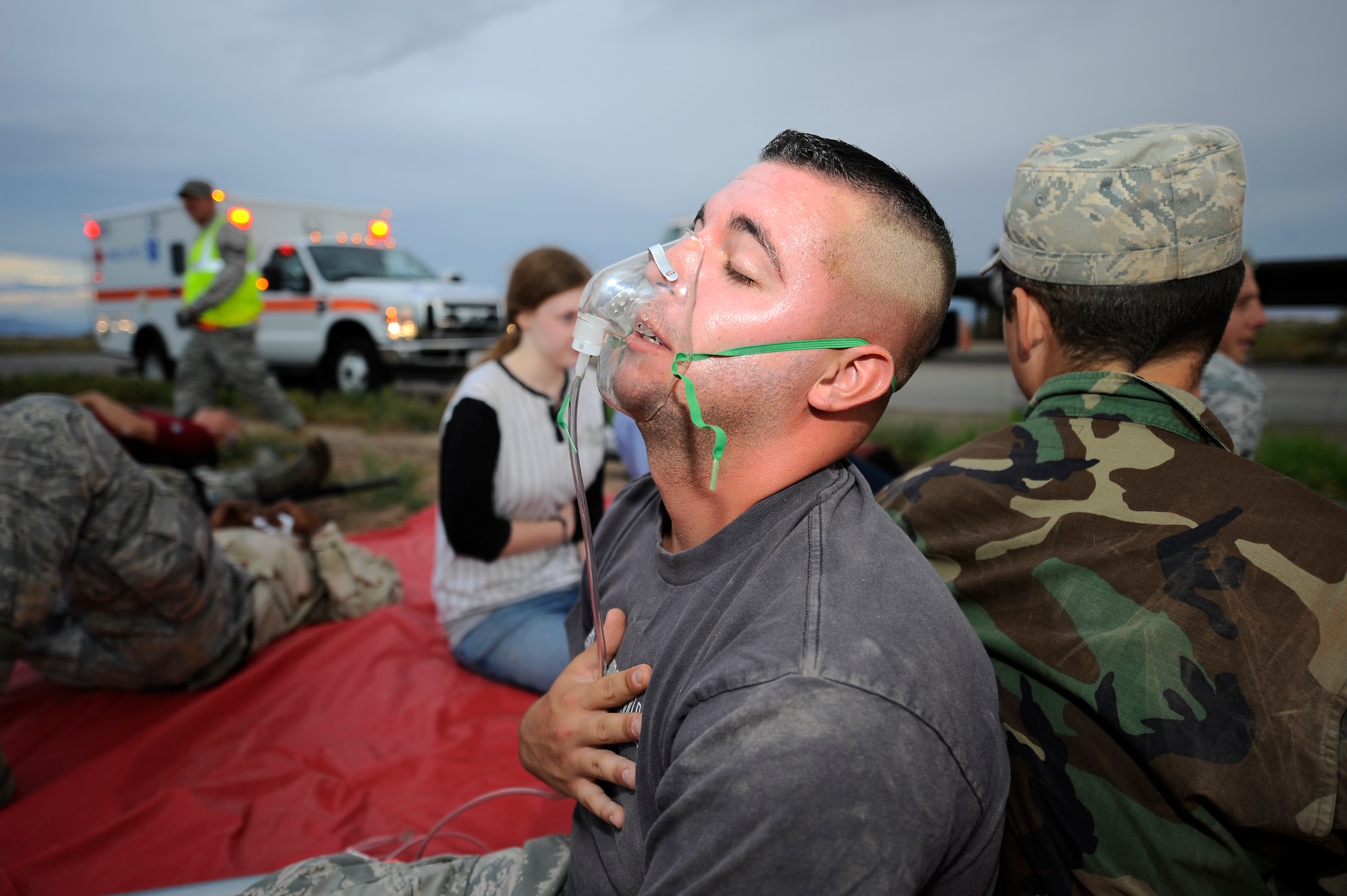 HOLLOMAN AIR FORCE BASE, N.M. -- Volunteers from Holloman and the local community participate in a simulated traffic accident during a Major Accident Response Exercise July 15, 2010. After evacuating the simulated casualties from the bus, they were placed in a triage area where their injuries were evaluated by the patient administration treatment team from the 49th Medical Group. (U.S. Air Force photo by Senior Airman Veronica Stamps / Released)