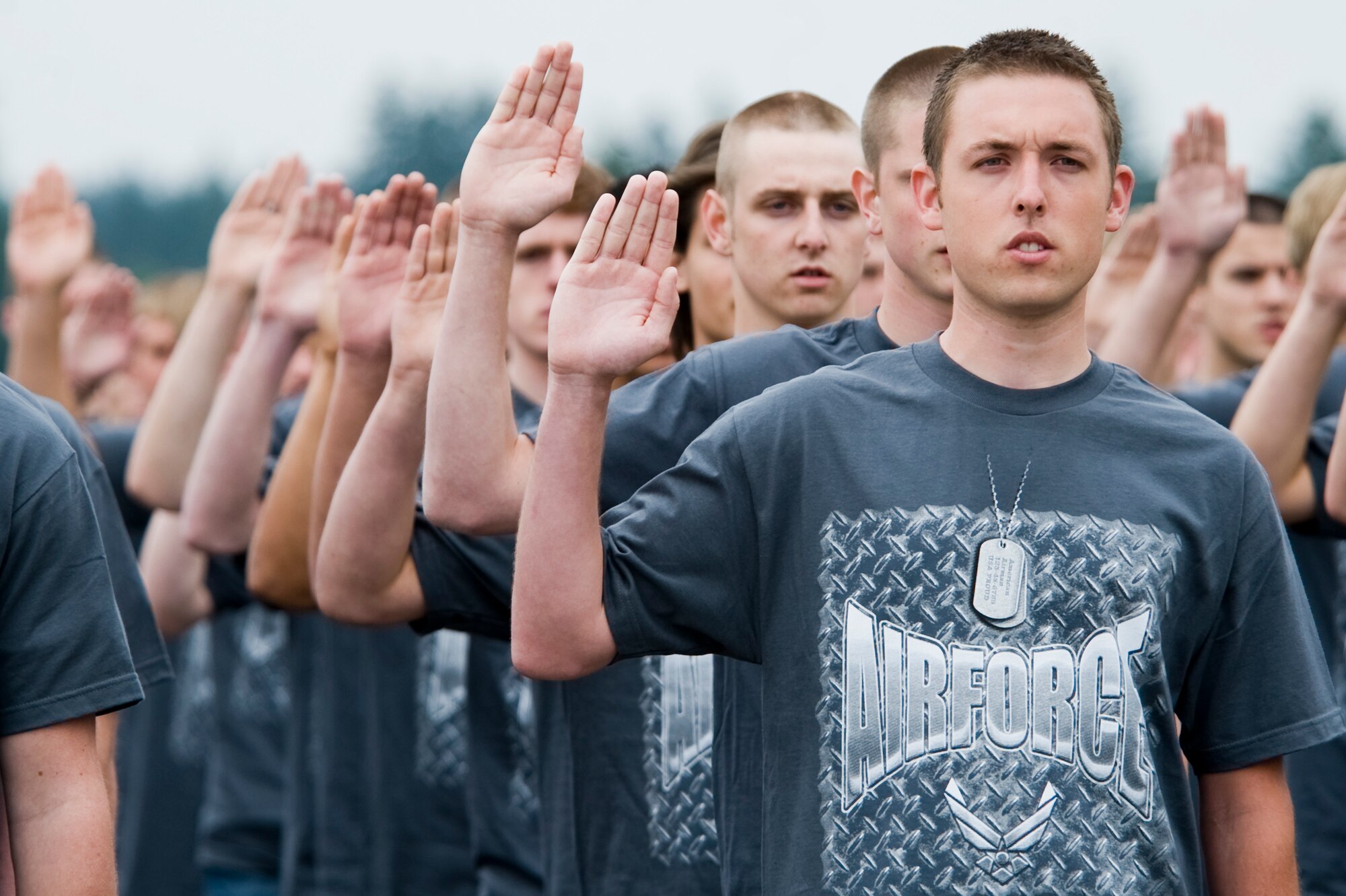 Members of the 361st Recruiting Squadron Delayed Entry Program show their dedication to joining the Air Force by publicly stating the oath of enlistment on the McChord Field flightline July 17. (U.S. Air Force Photo/Abner Guzman)