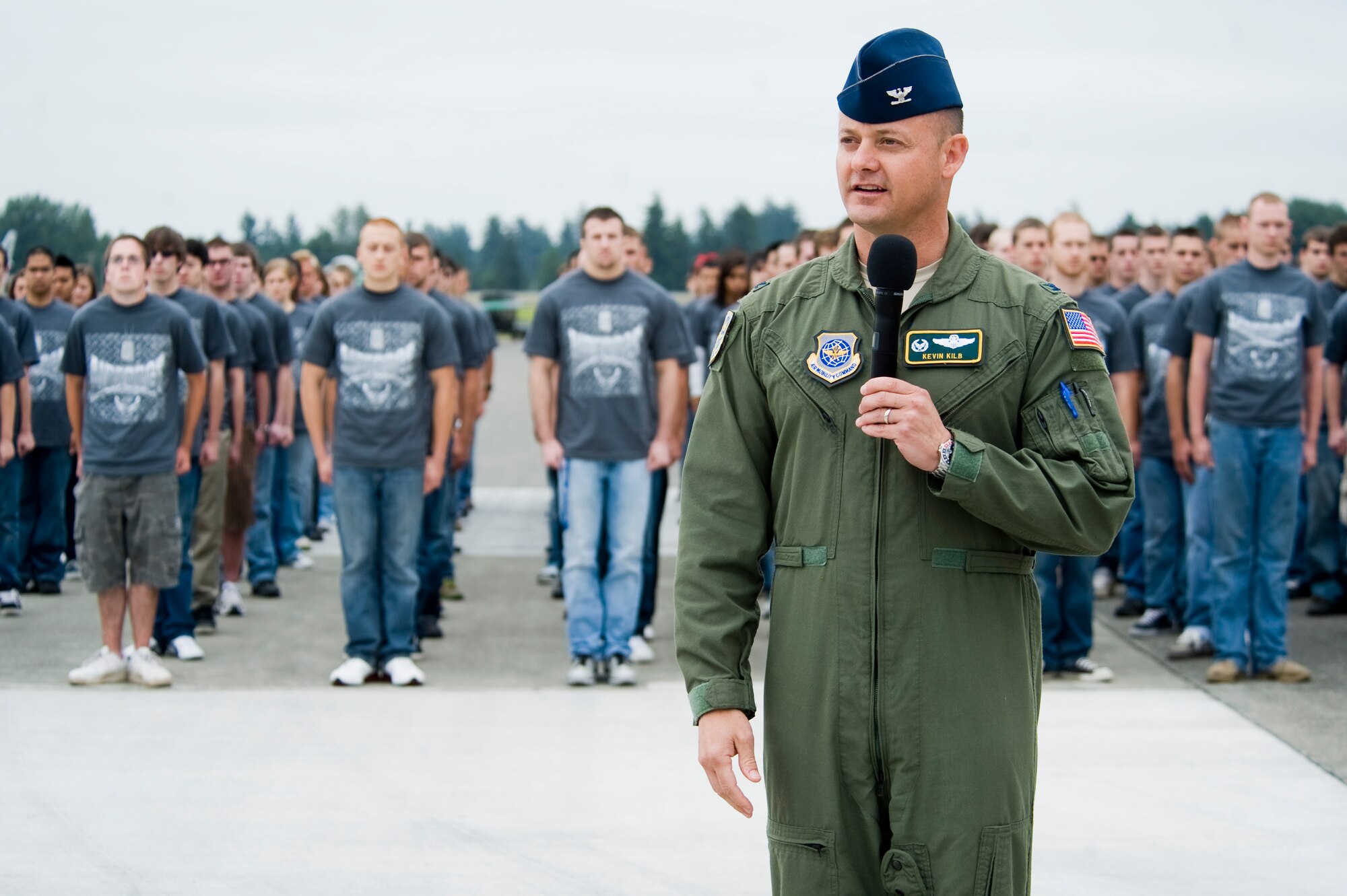 Col. Kevin Kilb, 62nd Airlift Wing commander, speaks to the audience during a record breaking enlistment ceremony at McChord Field July 17. (U.S. Air Force Photo/Abner Guzman)
