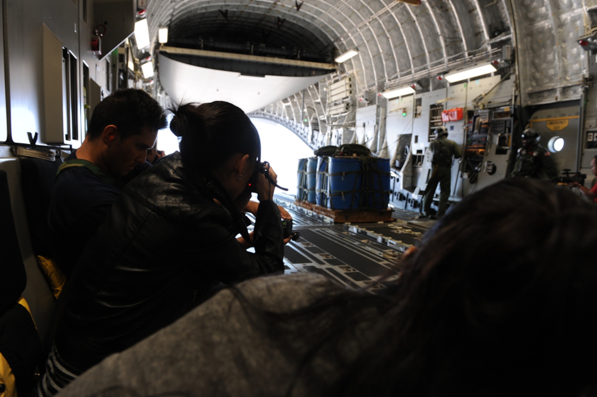 Local Hawaiian bloggers view an air drop from inside a C-17 Globemaster III July 16, 2010 while flying over Hawaii after departing Joint Base Pearl Harbor-Hickam,   Hawaii. (U.S.  Air Force photo/Tech Sgt. Cohen A. Young)