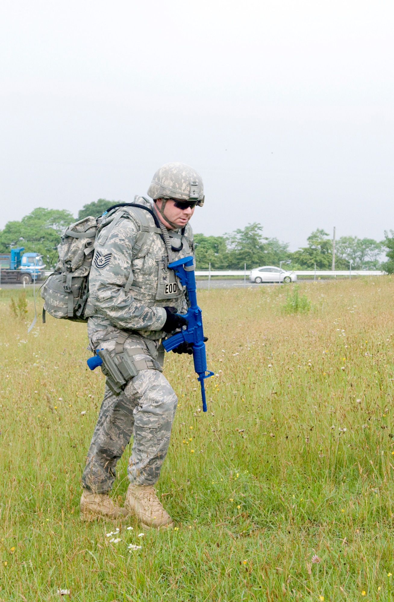 Tech. Sgt. Rory Stark ascends a hill July 9, 2010, during a ruck march, at Misawa Air Base, Japan. The sergeant participates in bi-monthly marches and drills with fellow EOD flight technicians, which prepares them for dismounted-patrol support while deployed. Sergeant Stark is an explosive ordnance disposal technician assigned to the 35th Civil Engineer Squadron. (U.S. Air Force photo/Senior Airman Jessica Lockoski)