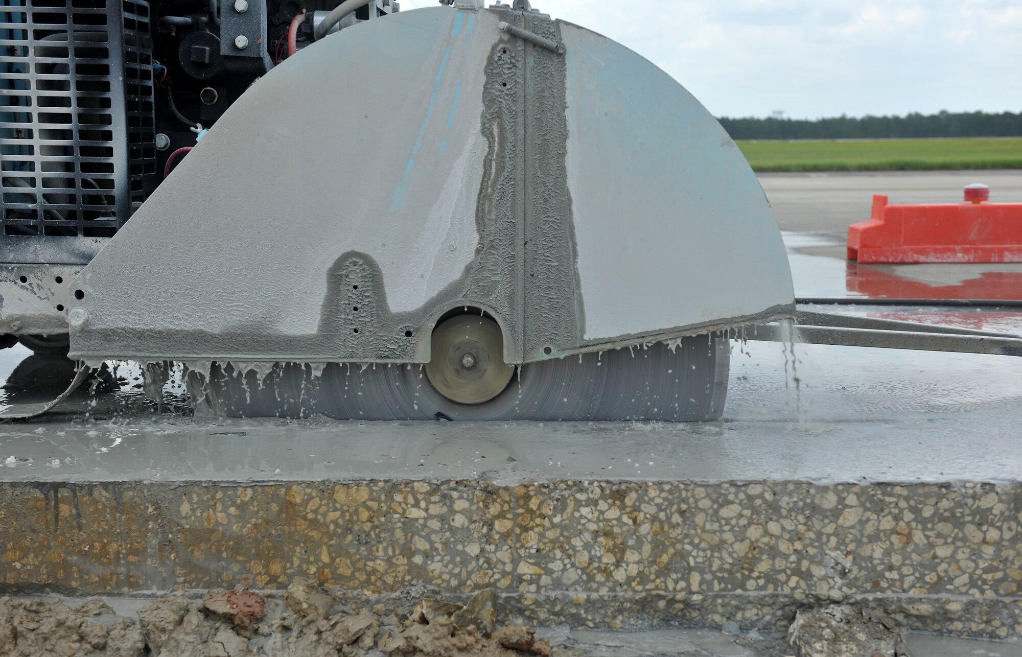 MOODY AIR FORCE BASE, Ga. -- A concrete saw cuts into six inches of concrete on a construction site here July 15. The construction consists of cutting through six inches of concrete and digging through 14 inches of dirt on a 4,300-square foot area on the airfield. (U.S. Air Force photo by Airman 1st Class Joshua Green/RELEASED)