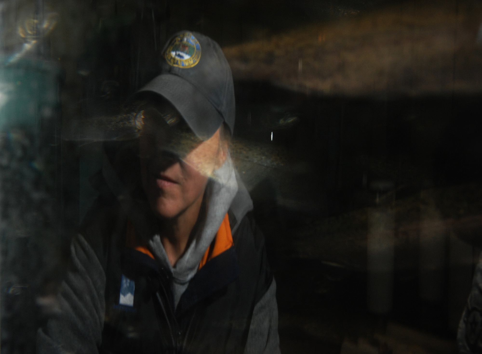 JOINT BASE ELMENDORF-RICHARDSON, Alaska -- Andrea Tesch, Fish Culturist III, monitors rainbow trout in their rearing tank at the Fort Richardson Hatchery, July 13. The new combined Joint Base Elmendorf-Richardson Hatchery will be named for William Jack Hernandez who started the Fort Richardson hatchery in the 1950s. (Air Force photo by Airman 1st Class Jack Sanders)