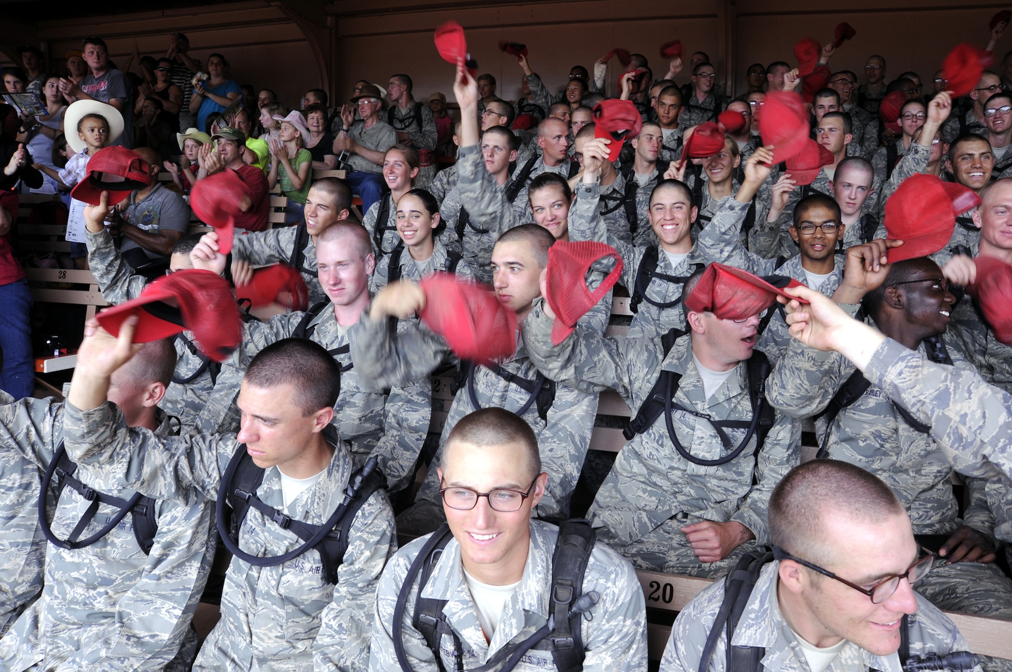 Basic cadets get rowdy during Air Force Academy/Family Day at the Pikes Peak or Bust Rodeo July 17, 2010. The rodeo was basic cadets' first chance to relax and enjoy ice cream, nachos and corn dogs since they began Basic Cadet Training June 24. (U.S. Air Force photo/Mike Kaplan)