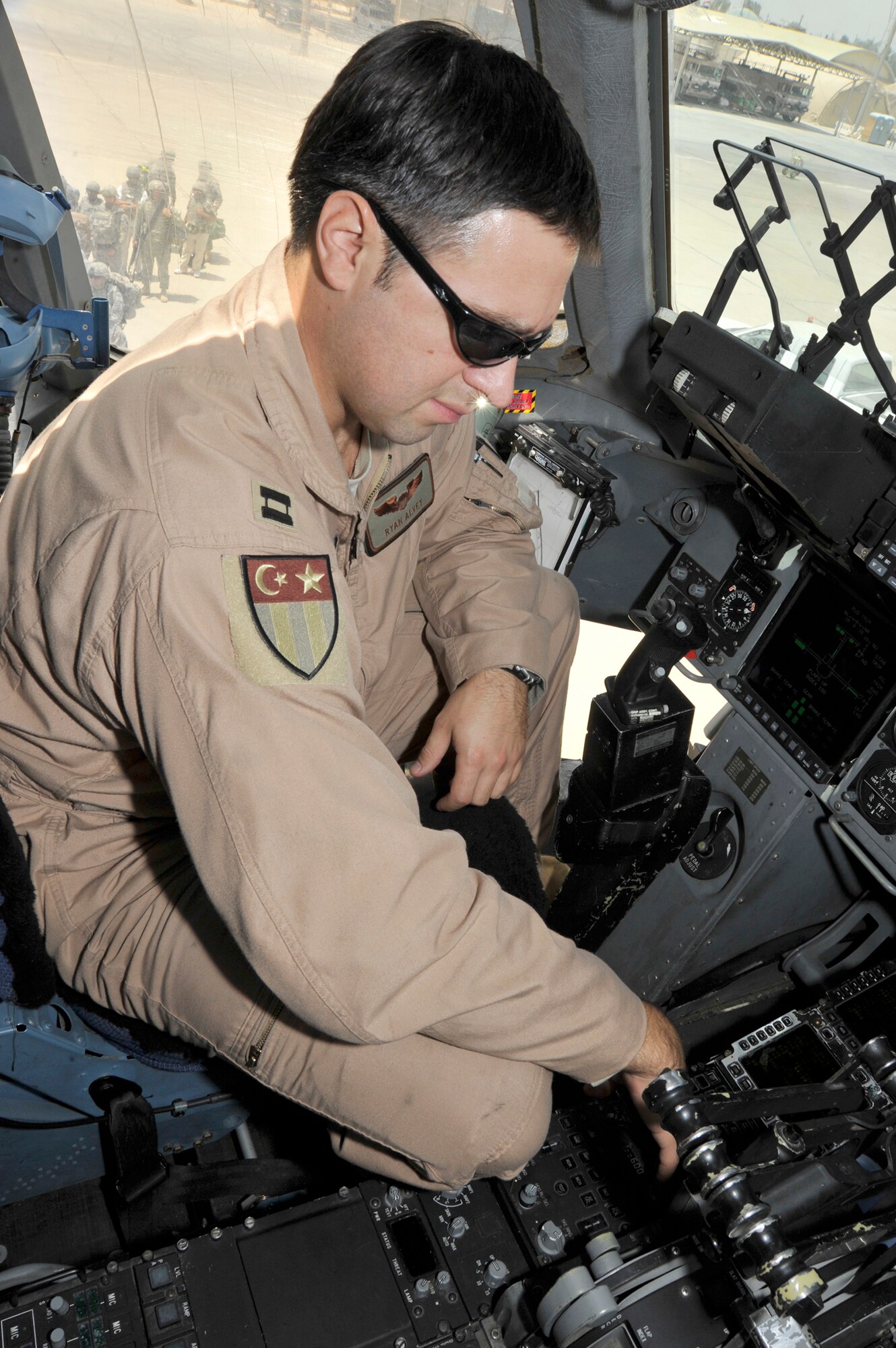 Capt. Ryan Alvey goes through the pre-flight checklist on a C-17 Globemaster III July 10, 2010, at Sather Air Base, Iraq. Air Force assets are assisting with the scheduled Iraq drawdown to 50,000 troops by August 31, 2010. Captain Alvey is the 817th Expeditionary Airlift Squadron Aircraft Commander. (U.S. Air Force photo/Senior Airman Perry Aston)