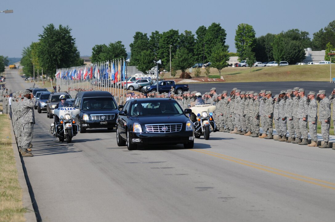 McGHEE TYSON AIR NATIONAL GUARD BASE, Tenn. - The staff and students of The I.G. Brown Air National Guard Training and Education Center join an honor cordon on Briscoe Drive here to pay tribute to a fallen soldier, July 7, 2010. Army Pfc. Robert K. L. Repkie, 20, of Knoxville, died June 24 at Forward Operating Base Farah, Afghanistan. (U.S. Air Force photo by Master Sgt. Kurt Skoglund/Released)