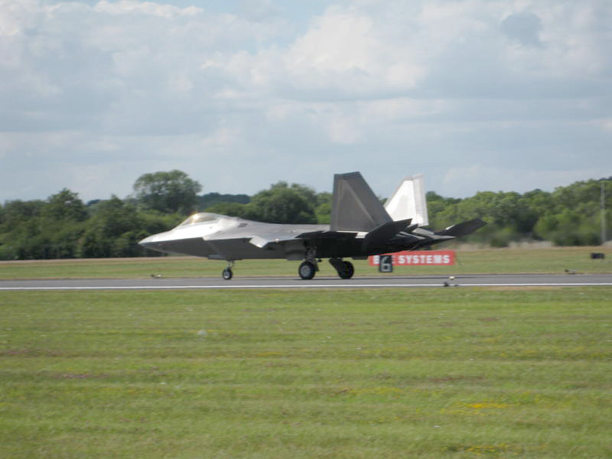 Maj. Dave Skalicky lands after an aerial demonstration of an F-22A Raptor during the Royal International Air Tattoo July 17, 2010, at Royal Air Force Fairford, England.  Major Skalicky is the F-22 Demonstration Team pilot.  The Raptor is based out of Joint Base Elmendorf-Richardson, Alaska.  (U.S. Air Force photo/Chief Master Sgt. Greg Wade)