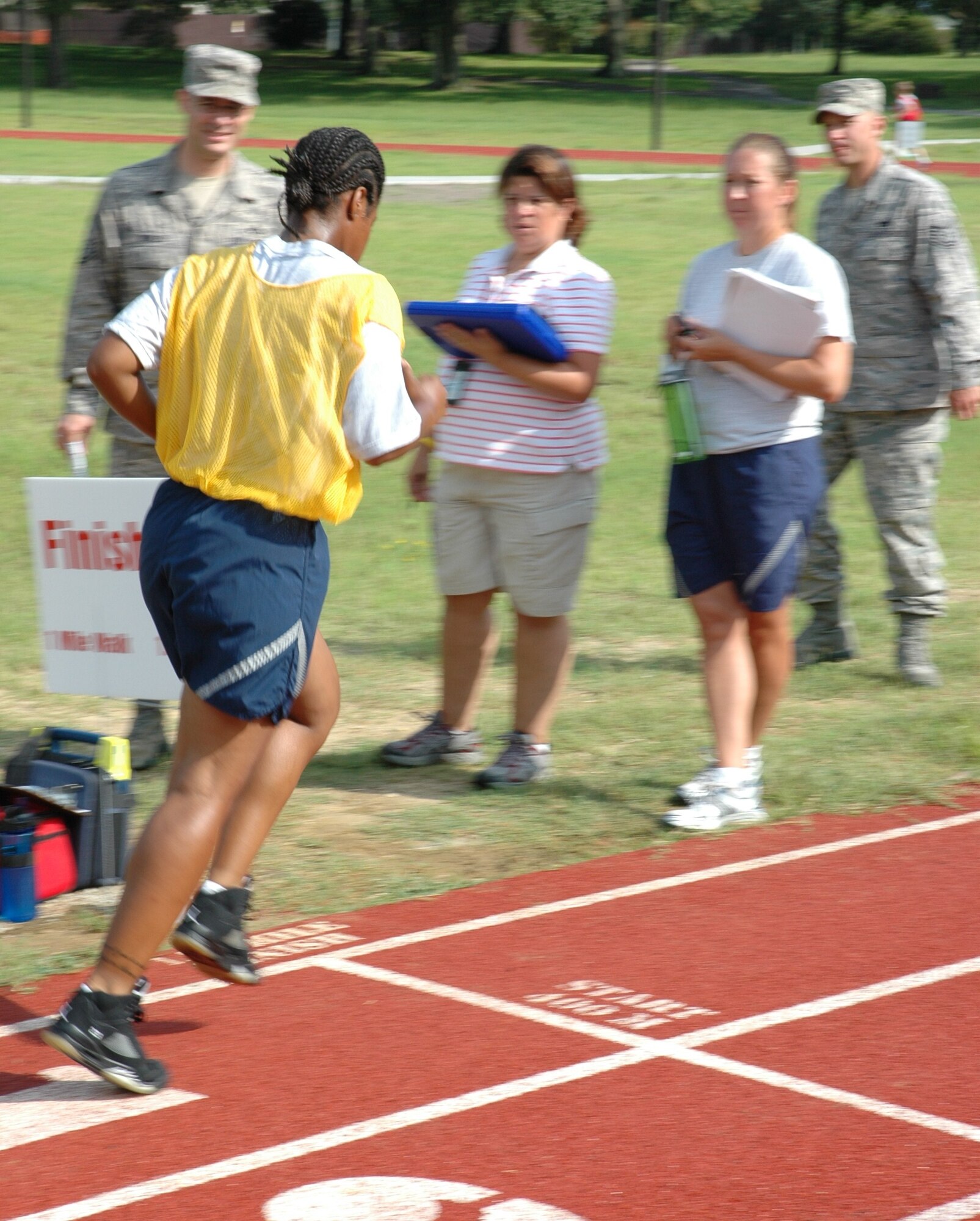 Staff Sgt. Calandra G. Cook completes a lap during her bi-annual physical fitness test July 11, 2010 at the base running track here. Sergeant Cook is a supply technician with the 38th Aerial Port Squadron here. (U.S. Air Force photo/Staff Sgt. Shane Ellis)