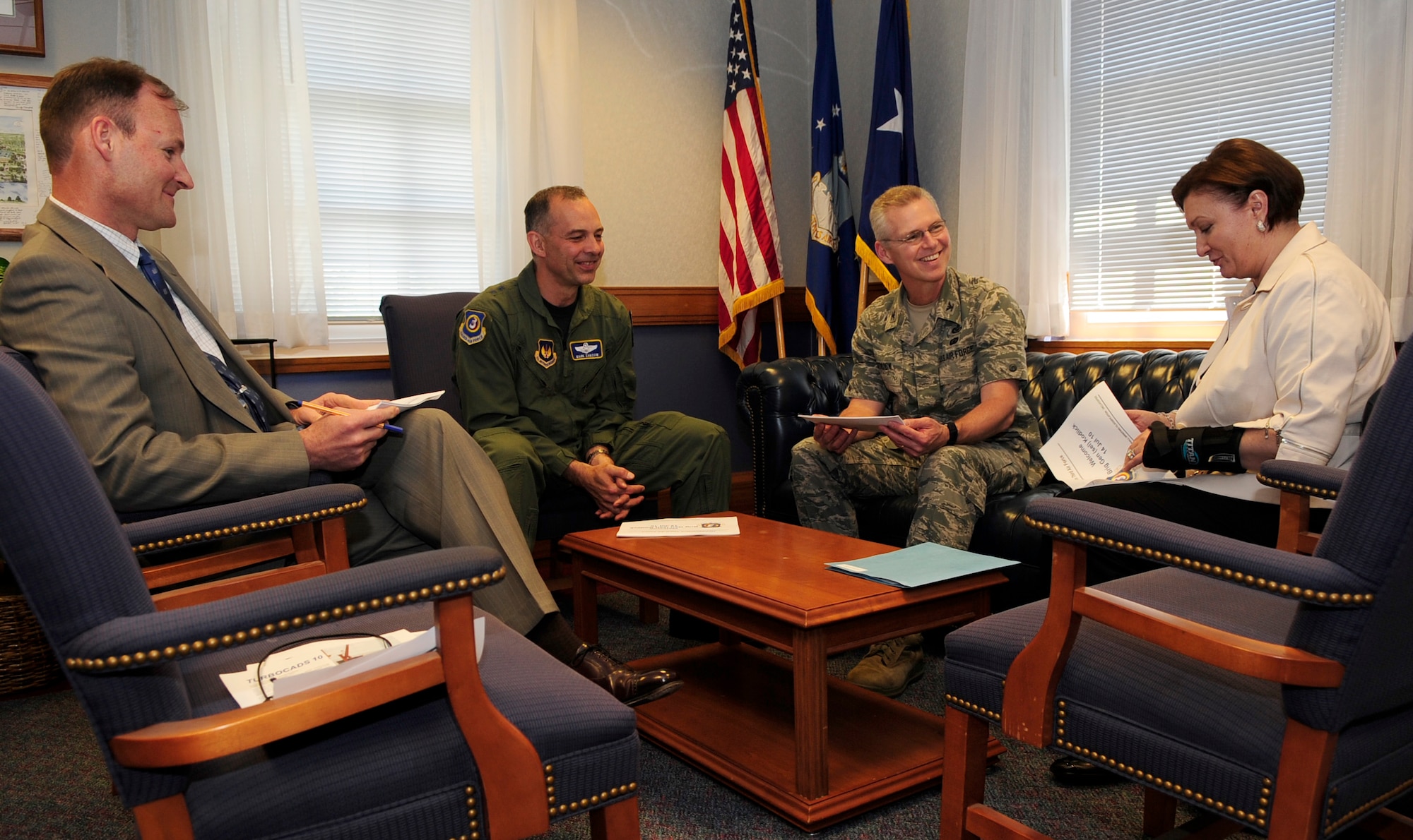 RAF MILDENHALL, England – Col. Les Kodlick, Director of Public Affairs, Office of the Secretary of the Air Force, and Susan Strednansky, U.S. Air Forces in Europe Public Affairs director, discuss their visit with Maj. Gen. Mark Zamzow, 3rd Air Force vice commander and Mark Silvanic, 3rd Air Force U.K. chief of staff,  about their visit to RAFs Mildenhall and Lakenheath July 15.  The visit targeted the public affairs offices on both bases, discussing upcoming policies and operational capabilities.  (U.S. Air Force photo/Staff Sgt. Christopher L. Ingersoll)