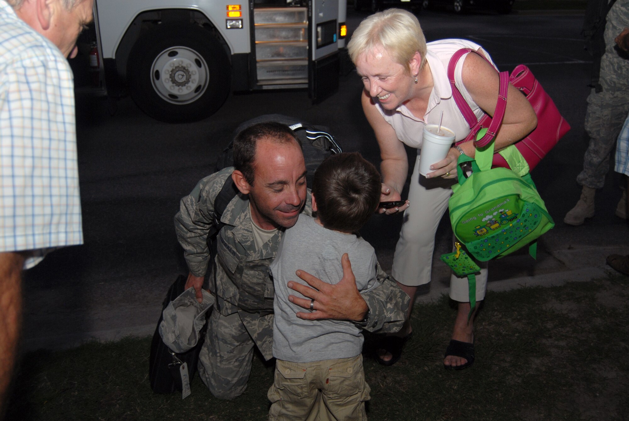 Staff Sgt. John Fitzgerald hugs his son, John after spending six months away from home during a deployment to Camp Bastion on July 14. Seven members of the 3rd APS returned to Pope after spending six months in Kandahar and Camp Bastion, Afghanistan. (U.S. Air Force photo/Senior Airman Kris Levasseur)