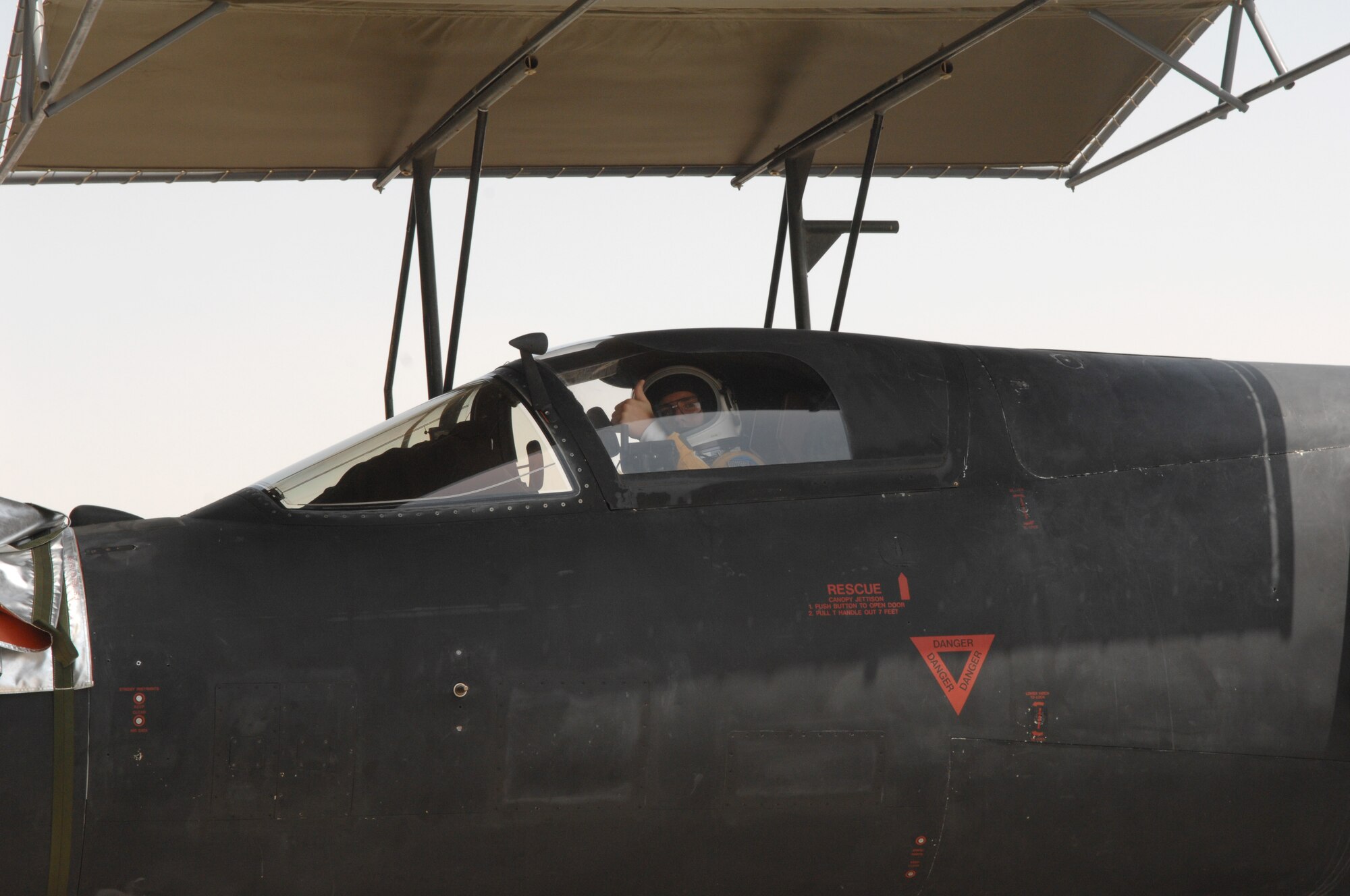 Capt. James Bartran, U2 Dragon Lady pilot, gives a thumps up after reaching his 1000th flying hour and 69th combat sortie in the U2 at an undisclosed location in Southwest Asia July 17. This is Captain Bartran’s seventh deployment piloting the Dragon Lady and the fifth flying with the 99th Expeditionary Reconnaissance Squadron. (U.S. Air Force photo/Tech.  Sgt. April Wickes)