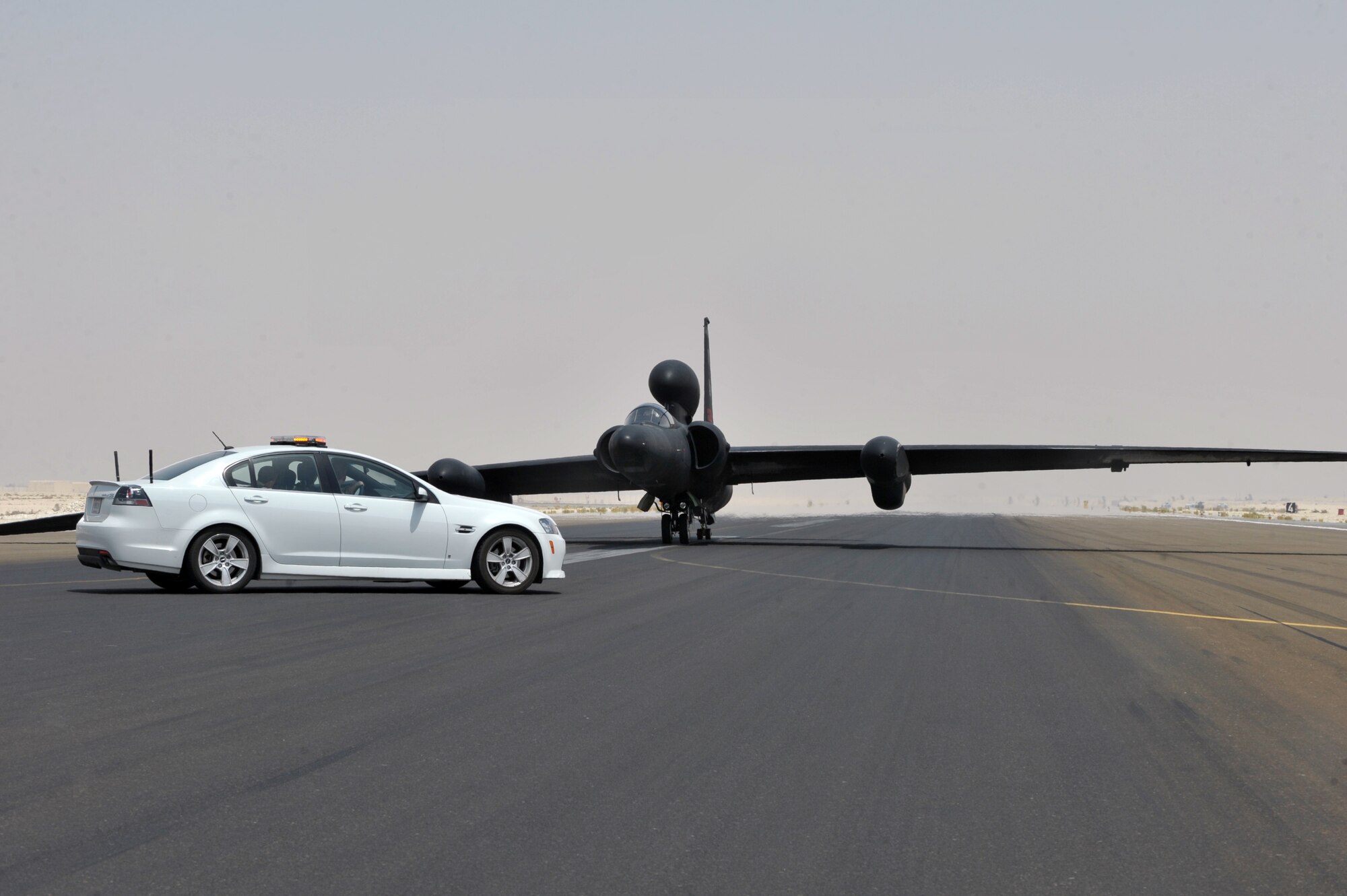 A U2 Dragon Lady, piloted by Capt. James Bartran, is parked on the flight line after the captain completed his 1000th flying hour and 69th combat sortie in the U2 at an undisclosed location in Southwest Asia July 17. This is Captain Bartran’s seventh deployment piloting the Dragon Lady and the fifth flying with the 99th Expeditionary Reconnaissance Squadron. (U.S. Air Force photo/Tech.  Sgt. April Wickes)