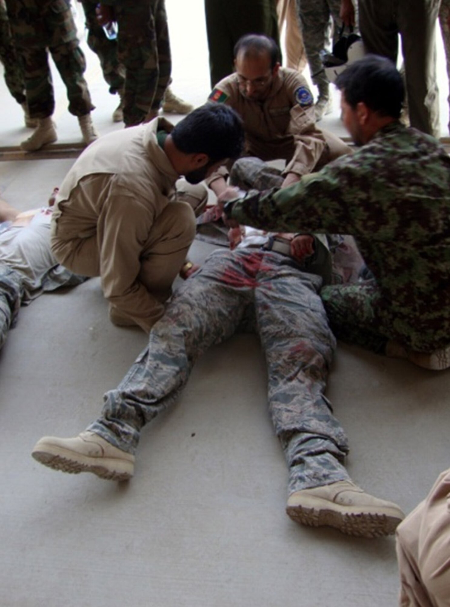 Afghan Air Force doctors and medics attend to "injured" members during a recent field training exercise July 11, 2010 Kandahar Air Wing Kandahar Airfield, Afghanistan, (Courtesy photo)