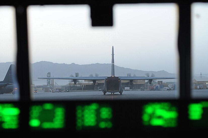 C-130Js deployed to the 772nd Expeditionary Airlift Squadron taxi to their loading spots  July 16, 2010 at Kandahar Airfield.  The C-130Js and crew are deployed from Little Rock Air Force Base, Ark., which has been deployed to Kandahar since March 2009.  (U.S. Air Force photo by Staff Sgt. Chad Chisholm/Released)