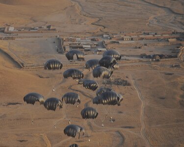 Multiple Low Velocity Low Cost Aerial Delivery System bundles begin to descend to a preset drop zone at a remote forward operating base in Afghanistan July 16, 2010.  The supplies delivered will replenish ground forces with water, food and other items needed to help sustain their living conditions.  (U.S. Air Force photo by Staff Sgt. Chad Chisholm/Released)