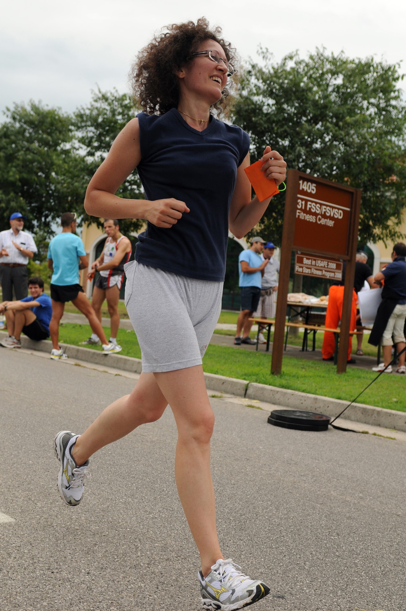 Andreetta Flora runs during the Rosario Scarpolini Association's first memorial foot race July 18 on base. The 31st Fighter Wing and the Italian air force's "Pagliano e Gori" Airport here collaborated in a joint effort to host the event. (U.S. Air Force photo/Staff Sgt. Julius Delos Reyes)