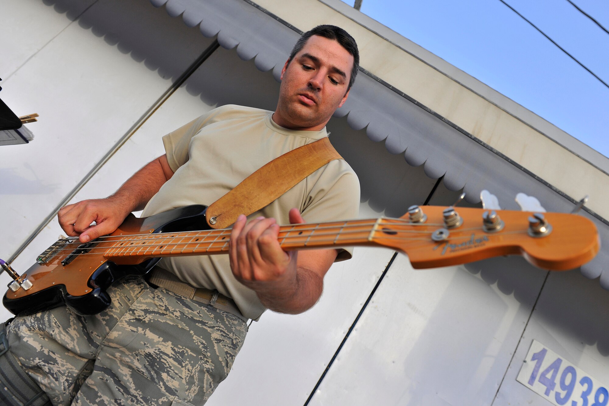 Tech. Sgt. Jeremy Buss, High Altitude bass player, performs for troops at the Base Exchange at Bagram Airfield, Afghanistan, July 14, 2010. The U.S. Air Forces Central Expeditionary Band is the first permanently assigned Air Force Band to the Central Command Area of Responsibility. (U.S. Air Force photo/Staff Sgt. Christopher Boitz)
