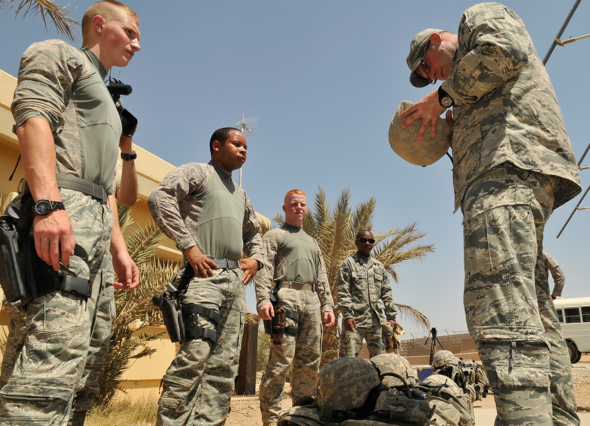 Tech. Sgt. John Holloman, 532nd Expeditionary Security Forces Squadron Lion 1-3 squad leader, inspects his Airmen’s personal protective equipment before a mission July 9, 2010, Joint Base Balad, Iraq. Airmen of the 532 ESFS carry a variety of PPE to include their weapons and body armor. Sergeant Holloman is a native of Mobile, Ala., deployed from Eielson Air Force Base, Alaska. (U.S. Air Force photo/Staff Sgt. Phillip Butterfield)
