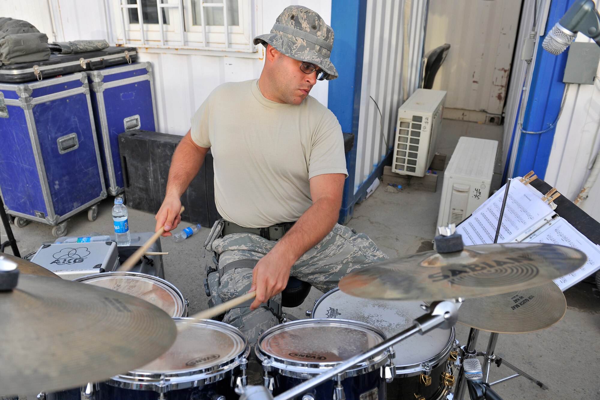 Staff Sgt. Brian Patishnock, High Altitude drummer, plays for troops during a performance at the Base Exchange at Bagram Airfield, Afghanistan, July 14, 2010. The U.S. Air Forces Central Expeditionary Band is the first permanently assigned Air Force Band to the Central Command Area of Responsibility. (U.S. Air Force photo/Staff Sgt. Christopher Boitz)