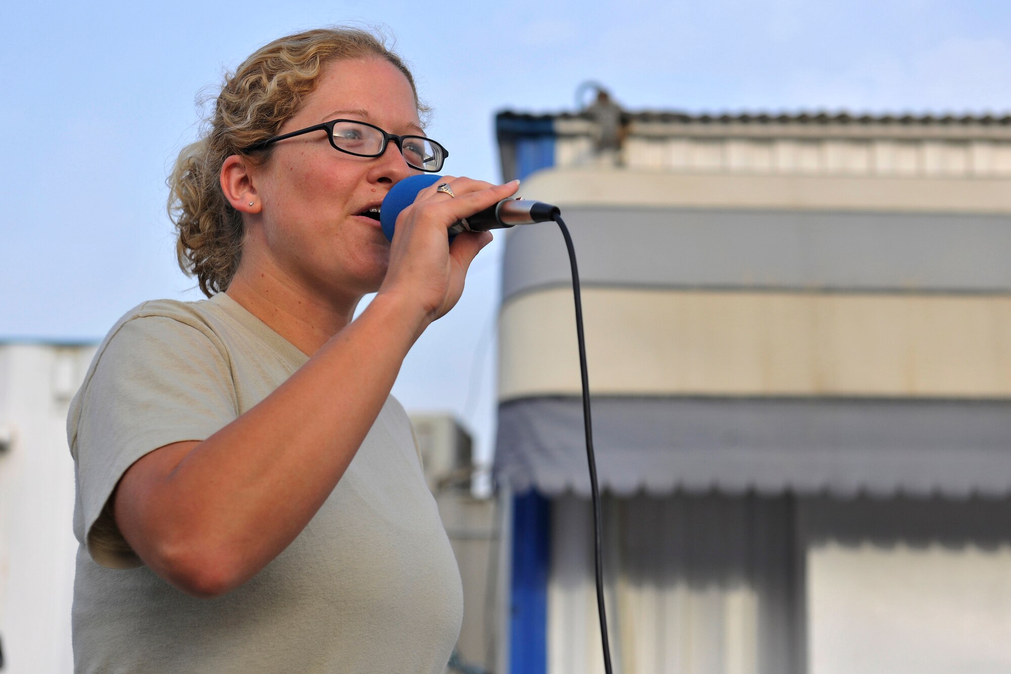 Tech. Sgt. Lori McCarty, High Altitude vocalist, sings for troops during a performance at the Base Exchange at Bagram Airfield, Afghanistan, July 14, 2010. The U.S. Air Forces Central Expeditionary Band is the first permanently assigned Air Force Band to the Central Command Area of Responsibility. (U.S. Air Force photo/Staff Sgt. Christopher Boitz)
