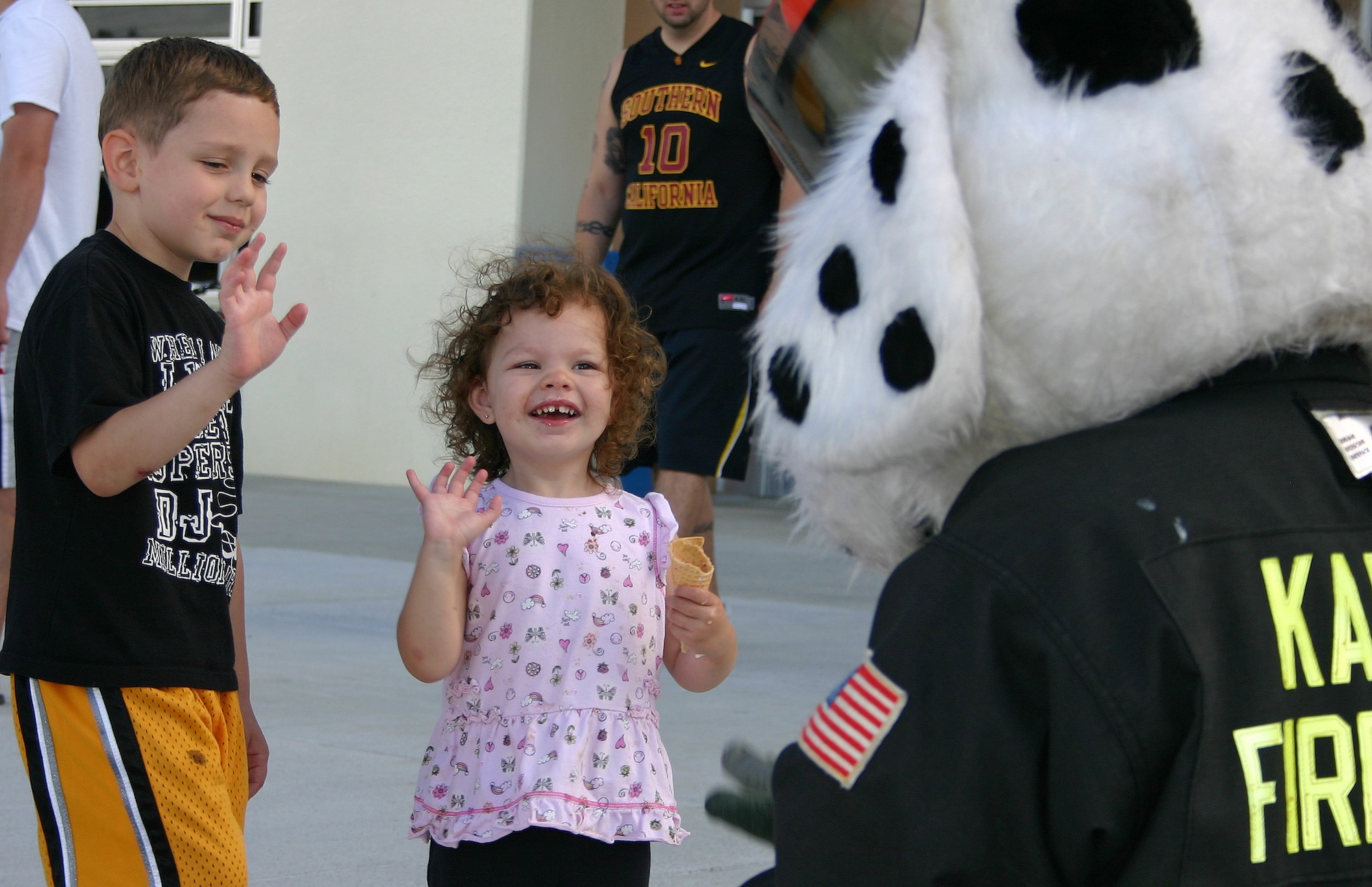 Sparky the Fire Dog greets children during Kadena's Fill the Boot fundraiser in front of the base exchange, commissary and shoppette July 18. Kadena's fire department and volunteers raised more than $21,000 toward this year's Special Olympics scheduled for this fall. Last year, more than 2,000 volunteers and 800-plus athletes participated in the 10th Annual Kadena Special Olympic Games. (Air Force/Reiko Lake)