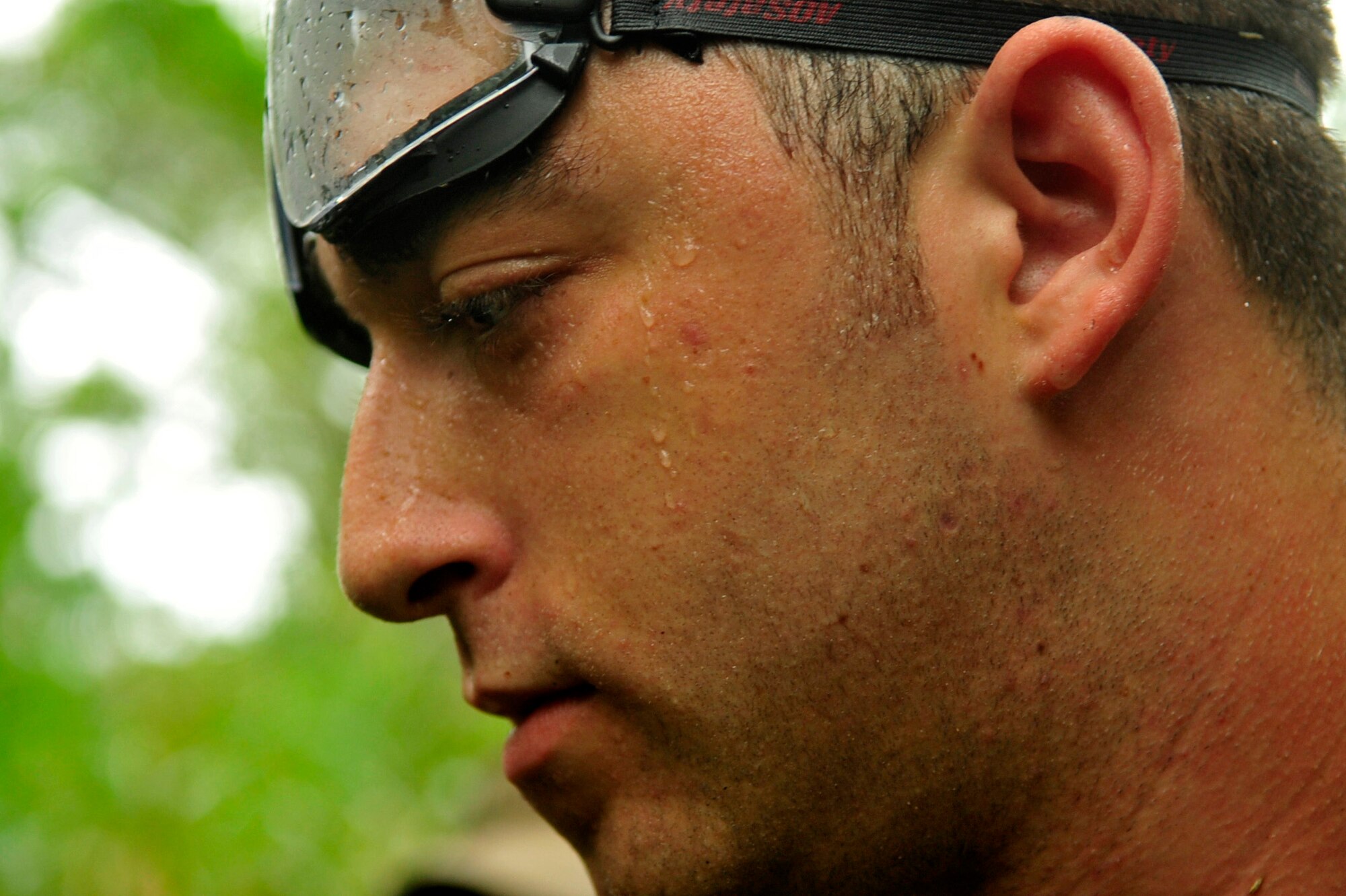 Airman 1st Class Michael Mendes, member of the 17th Special Operations Squadron, finds the coordinates on a global positioning system to pinpoint the correct direction to travel during an exercise at Kadena Air Base’s Area 1 July 1. Every three years aircrew members must undergo a refresher course of Survival, Evasion, Resistance and Escape training. (U.S. Air Force photo by Senior Airman Amanda Grabiec)