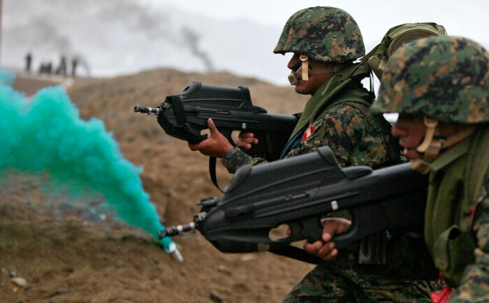 Peruvian marines carrying F2000 assault rifles attack a beach with service members from 10 nations during a large-scale multinational amphibious beach assault in Ancon, Peru, July 19. U.S. Marines were deployed in support of operation Partnership of the Americas/Southern Exchange, a combined amphibious exercise with maritime forces from Argentina, Mexico, Peru, Brazil, Uruguay and Colombia.