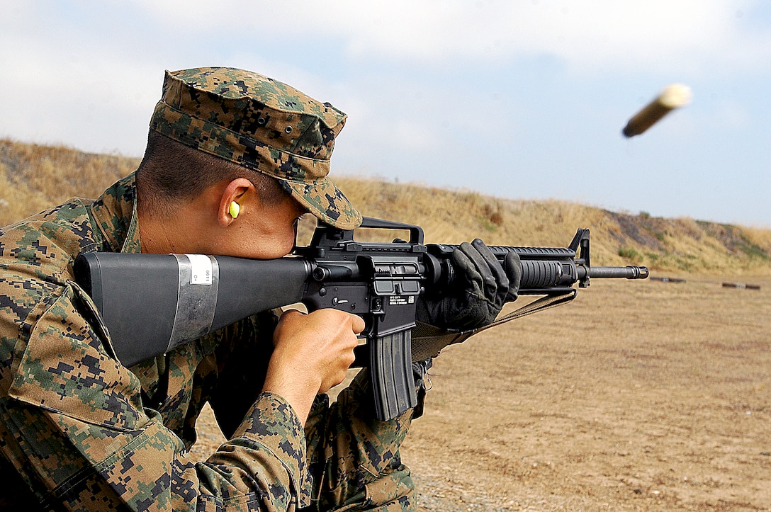Recruit Jerrod Smith, Platoon 3236, Company K fires another round from his M-16A4 service rifle during a rapid fire portion of the rifle range at Edson Range, Marine Corps Base Camp Pendleton Calif., July 19. Smith will be the first of many recruits who carries, cleans, drills with and fires that specific M-16A4 because of the constant flow of recruits attempting to become Marines here.