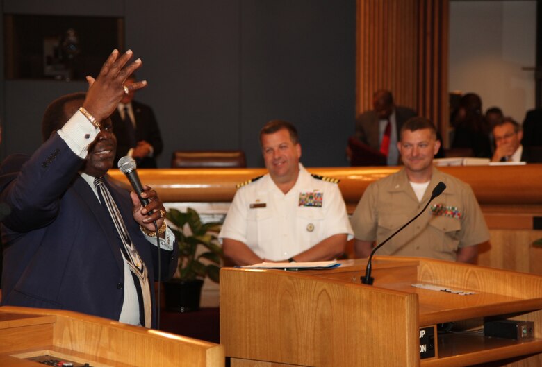 Miami-Dade County Commissioner Dorrin Rolle welcomes Navy Capt. Jeff Amick, USS Iwo Jima commanding officer, and Lt. Col. Chris S. Richie, Special-Purpose Marine Air-Ground Task Force Continuing Promise 2010 commanding officer, to the city of Miami, Fla., July 20, 2010, during a county commissioners meeting. During the meeting, Amick and Richie were presented with a key to Miami-Dade County for the efforts of CP10’s upcoming humanitarian assistance to the Caribbean, Central and South America.
