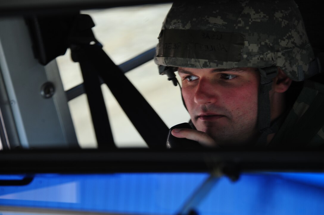 ELLSWORTH AIR FORCE BASE, S.D. – Airman 1st Class Gregory Hulett, 28th Logistics Readiness Squadron vehicle operator, updates his status on a radio during a phase II operational readiness exercise, July 20. The exercise provides training and prepares Airmen for worldwide deployments.  (U.S. Air Force photo/Airman 1st Class Corey Hook)