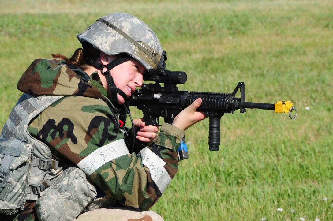 ELLSWORTH AIR FORCE BASE S.D. -- Senior Airman Kristi Terwilliger, 28th Security Forces Squadron controller, checks the simulated perimeter during a phase II operational readiness exercise, July 20.  Airmen endure heat and stress in Mission Oriented Protective Posture gear. (U.S. Air Force photo/Airman 1st Class Anthony Sanchelli)