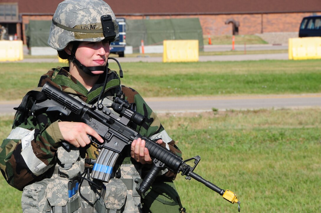 ELLSWORTH AIR FORCE BASE S.D. -- Senior Airman Kristi Terwilliger, 28th Security Forces Squadron controller, patrols the simulated perimiter during a phase II operational readiness exercise, July 20.  The phase II ORE is designed to test Airmen on operational readiness during a simulated deployment. (U.S. Air Force photo/Airman 1st Class Anthony Sanchelli)
