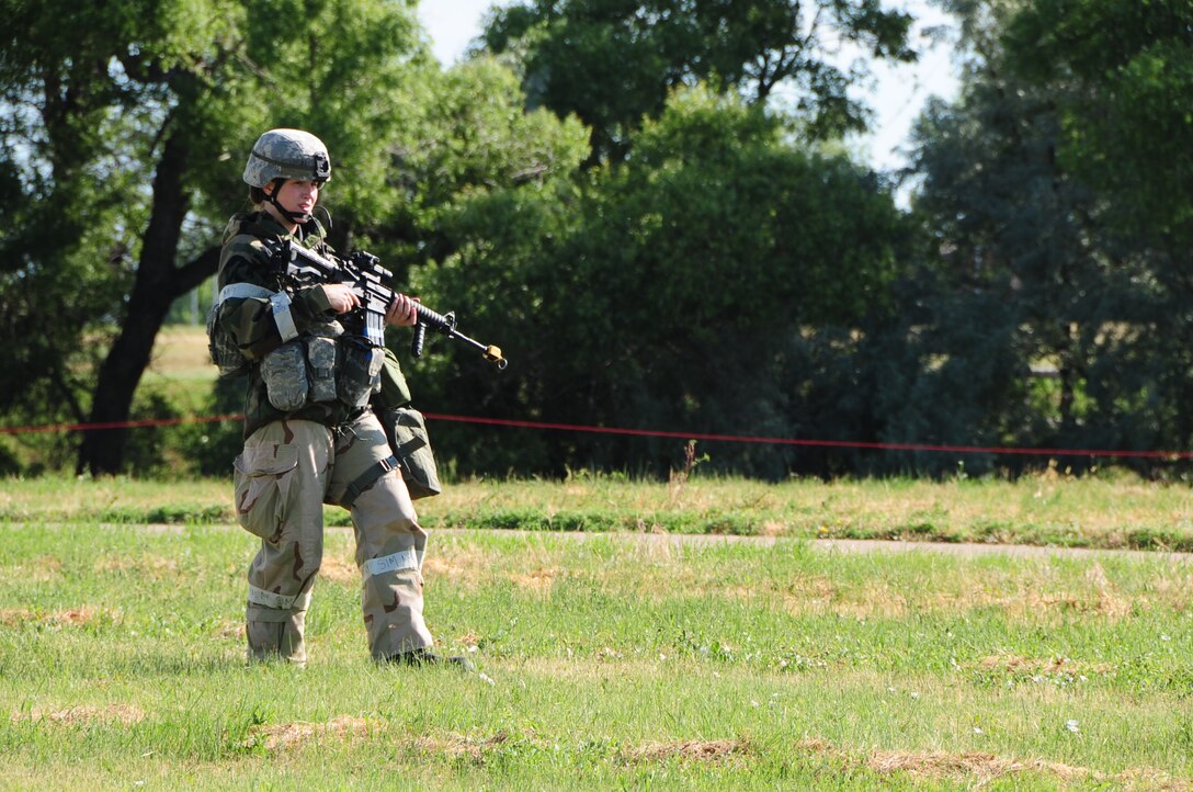 ELLSWORTH AIR FORCE BASE S.D. -- Senior Airman Kristi Terwilliger, 28th Security Forces Squadron controller, patrols the simulated perimiter during a phase II operational readiness exercise, July 20.  The phase II ORE is designed to test Airmen in a simulated deployed environment. (U.S. Air Force photo/Airman 1st Class Anthony Sanchelli)